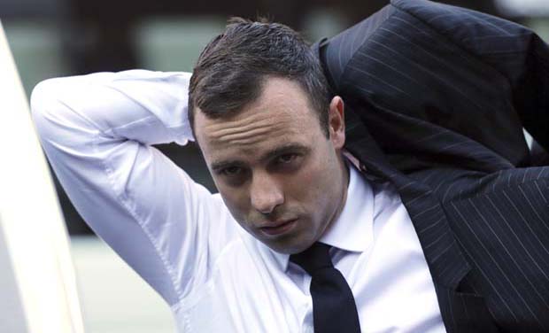 Oscar Pistorius puts on his jacket as he arrives at the high court in Pretoria, South Africa, (Photo: AP) Oscar Pistorius puts on his jacket as he arrives at the high court in Pretoria, South Africa, (Photo: AP)